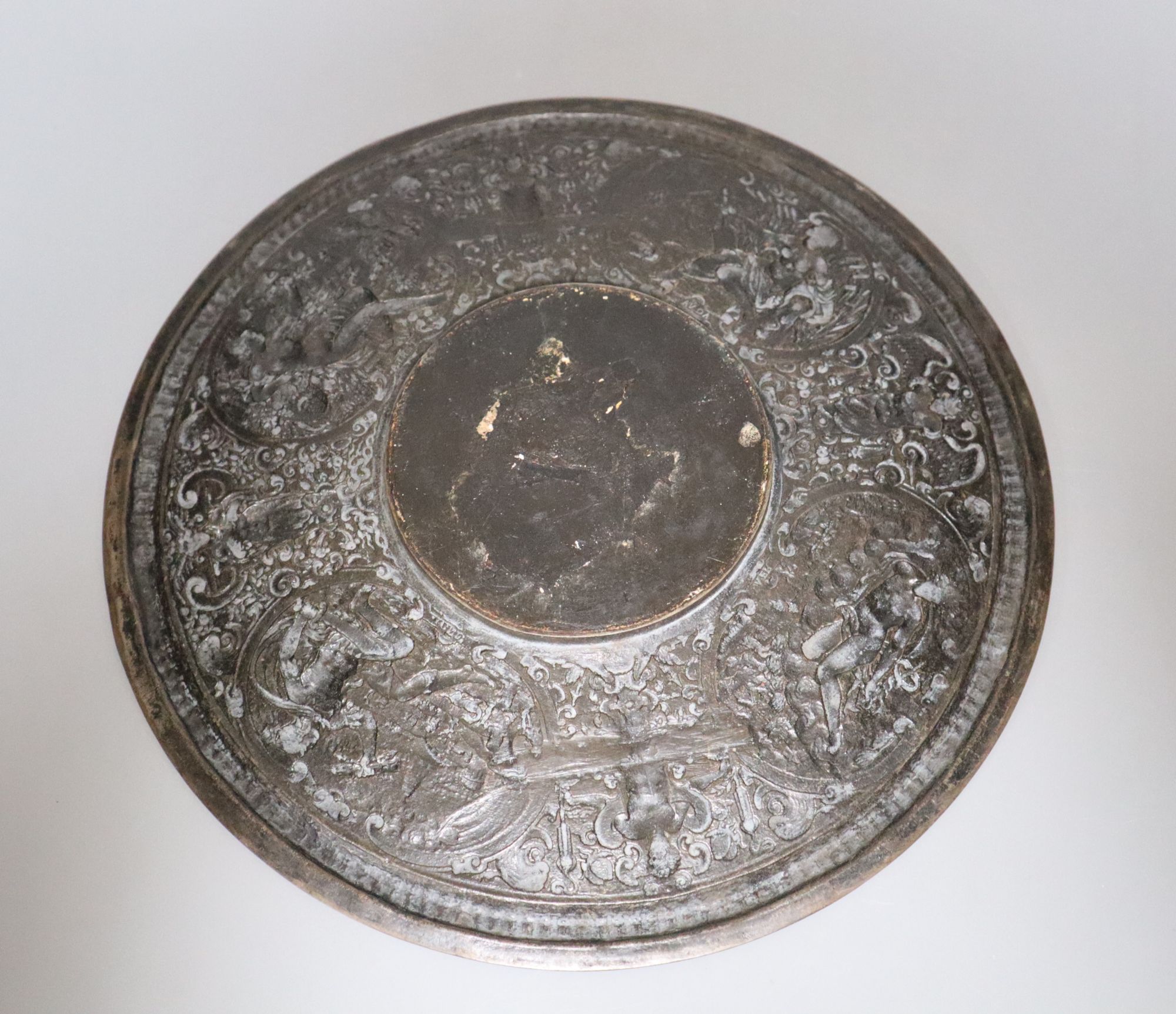 A bronzed metal plaque, diameter 28cm
